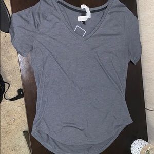 Plain grey adidas shirt with logo on the back